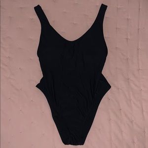 Black one piece bathing suit.